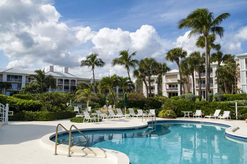 Pool side view with buildings in background