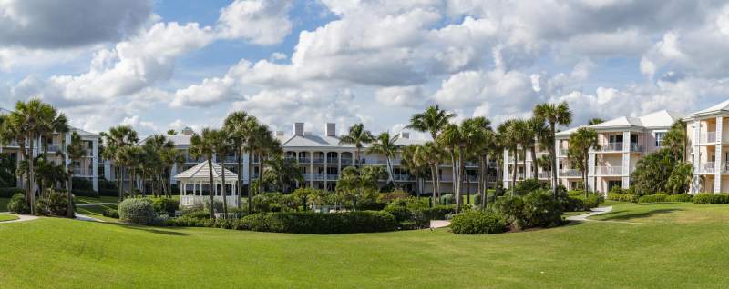 The green grass on the land with a gazebo